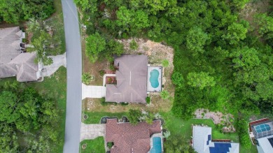 Welcome to this spacious 3-bedroom, 2-bath pool home with nearly on Sugarmill Woods Golf and Country Club in Florida - for sale on GolfHomes.com, golf home, golf lot