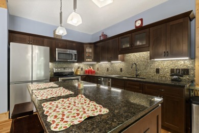 Experience year-round comfort and elegance in this like-new on Crystal Mountain Golf Course in Michigan - for sale on GolfHomes.com, golf home, golf lot