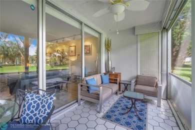 Step into this stunning first-floor unit in the highly on Palm-Aire Country Club and Resort - The Oaks in Florida - for sale on GolfHomes.com, golf home, golf lot