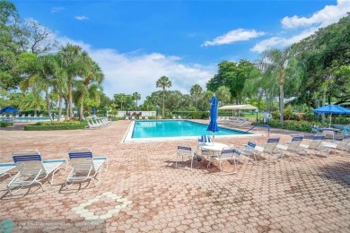 Step into this stunning first-floor unit in the highly on Palm-Aire Country Club and Resort - The Oaks in Florida - for sale on GolfHomes.com, golf home, golf lot