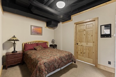 Experience year-round comfort and elegance in this like-new on Crystal Mountain Golf Course in Michigan - for sale on GolfHomes.com, golf home, golf lot