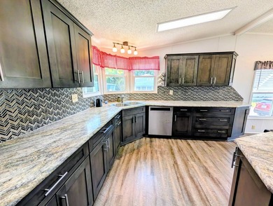 Welcome to this beautifully maintained and thoughtfully updated on Grasslands Golf and Country Club in Florida - for sale on GolfHomes.com, golf home, golf lot