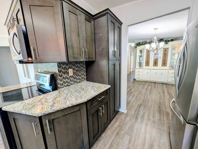 Welcome to this beautifully maintained and thoughtfully updated on Grasslands Golf and Country Club in Florida - for sale on GolfHomes.com, golf home, golf lot