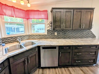 Welcome to this beautifully maintained and thoughtfully updated on Grasslands Golf and Country Club in Florida - for sale on GolfHomes.com, golf home, golf lot