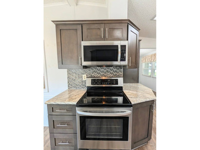 Welcome to this beautifully maintained and thoughtfully updated on Grasslands Golf and Country Club in Florida - for sale on GolfHomes.com, golf home, golf lot