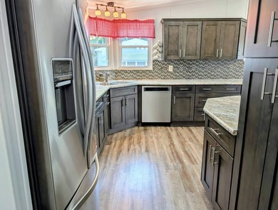 Welcome to this beautifully maintained and thoughtfully updated on Grasslands Golf and Country Club in Florida - for sale on GolfHomes.com, golf home, golf lot