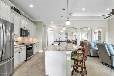 This exquisite home is situated in the award-winning Pelican on Pelican Preserve Golf Club in Florida - for sale on GolfHomes.com, golf home, golf lot