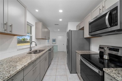 Welcome to your beautifully updated Florida retreat in the on Duffys Golf Center in Florida - for sale on GolfHomes.com, golf home, golf lot