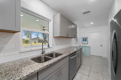 Welcome to your beautifully updated Florida retreat in the on Duffys Golf Center in Florida - for sale on GolfHomes.com, golf home, golf lot