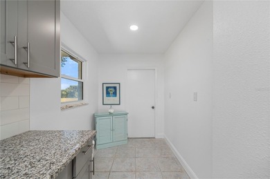 Welcome to your beautifully updated Florida retreat in the on Duffys Golf Center in Florida - for sale on GolfHomes.com, golf home, golf lot