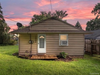 Discover the perfect blend of charm and comfort with this on Highland Hills Golf Course in Michigan - for sale on GolfHomes.com, golf home, golf lot