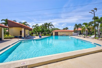 Located in the desirable gated community of Hammock Pine Village on Countryside Country Club in Florida - for sale on GolfHomes.com, golf home, golf lot