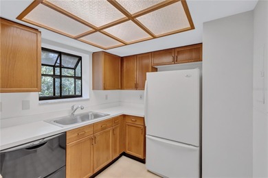 Located in the desirable gated community of Hammock Pine Village on Countryside Country Club in Florida - for sale on GolfHomes.com, golf home, golf lot