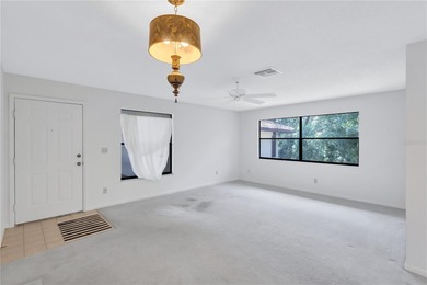 Located in the desirable gated community of Hammock Pine Village on Countryside Country Club in Florida - for sale on GolfHomes.com, golf home, golf lot