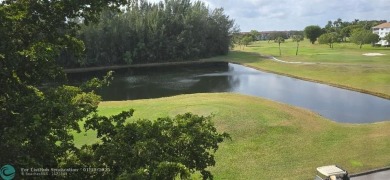Serene golf course and water views from the large, screened on Flamingo Lakes Country Club in Florida - for sale on GolfHomes.com, golf home, golf lot