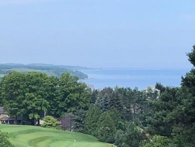 SPECTACULAR LAKE MICHIGAN VIEWS with beautiful views of the on Crooked Tree Golf Club in Michigan - for sale on GolfHomes.com, golf home, golf lot