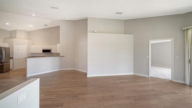 Located in the secure, private gated community of Sabal Trace on Sabal Trace Golf and Country Club in Florida - for sale on GolfHomes.com, golf home, golf lot