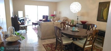 Serene golf course and water views from the large, screened on Flamingo Lakes Country Club in Florida - for sale on GolfHomes.com, golf home, golf lot