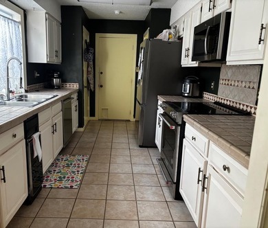 Beautiful home on quiet cul-de-sac on Diamondhead's Pines Golf on Diamondhead Country Club in Mississippi - for sale on GolfHomes.com, golf home, golf lot