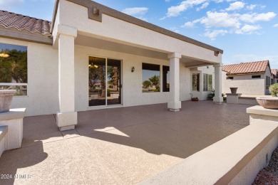 Discover this popular Palo Verde model nestled on the 7th green on Sun City Grand Golf Couse and Club in Arizona - for sale on GolfHomes.com, golf home, golf lot