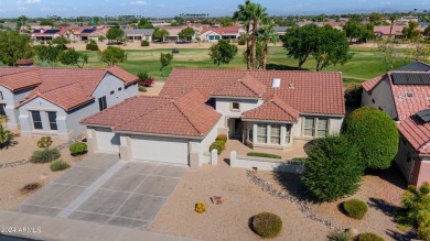 Discover this popular Palo Verde model nestled on the 7th green on Sun City Grand Golf Couse and Club in Arizona - for sale on GolfHomes.com, golf home, golf lot