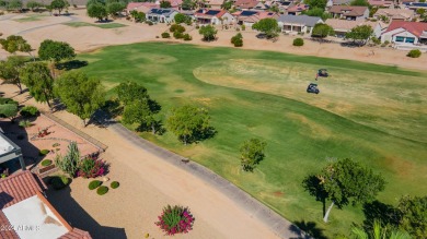 Discover this popular Palo Verde model nestled on the 7th green on Sun City Grand Golf Couse and Club in Arizona - for sale on GolfHomes.com, golf home, golf lot