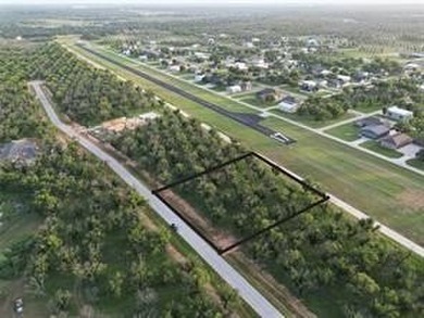 Lot 4011 Experience luxury living at The Landings Airpark near on Pecan Plantation Country Club in Texas - for sale on GolfHomes.com, golf home, golf lot