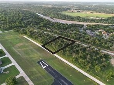 Lot 4011 Experience luxury living at The Landings Airpark near on Pecan Plantation Country Club in Texas - for sale on GolfHomes.com, golf home, golf lot