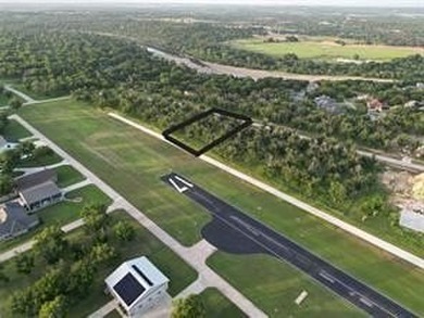 Lot 4011 Experience luxury living at The Landings Airpark near on Pecan Plantation Country Club in Texas - for sale on GolfHomes.com, golf home, golf lot