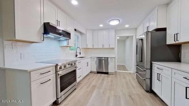 This beautifully renovated single-story home offers a modern on The Lakes Country Club in North Carolina - for sale on GolfHomes.com, golf home, golf lot