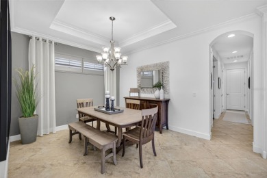 Luxuriously Upgraded Roma Model with Pond Views & Room for a on Esplanade Golf and Country at Lakewood Ranch in Florida - for sale on GolfHomes.com, golf home, golf lot