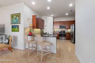 Beautiful Arbour II Villa features a Dining/Living room on Plantation Bay Golf and Country Club in Florida - for sale on GolfHomes.com, golf home, golf lot