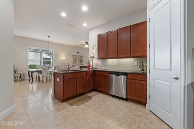 Beautiful Arbour II Villa features a Dining/Living room on Plantation Bay Golf and Country Club in Florida - for sale on GolfHomes.com, golf home, golf lot