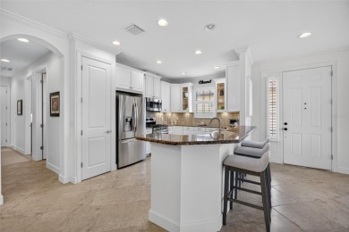 Luxuriously Upgraded Roma Model with Pond Views & Room for a on Esplanade Golf and Country at Lakewood Ranch in Florida - for sale on GolfHomes.com, golf home, golf lot