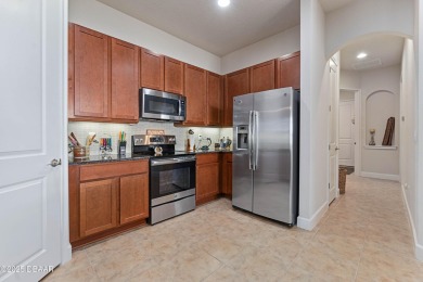 Beautiful Arbour II Villa features a Dining/Living room on Plantation Bay Golf and Country Club in Florida - for sale on GolfHomes.com, golf home, golf lot