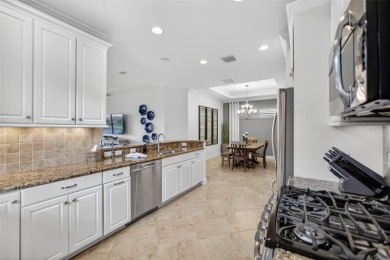 Luxuriously Upgraded Roma Model with Pond Views & Room for a on Esplanade Golf and Country at Lakewood Ranch in Florida - for sale on GolfHomes.com, golf home, golf lot