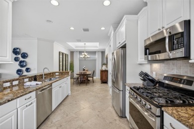 Luxuriously Upgraded Roma Model with Pond Views & Room for a on Esplanade Golf and Country at Lakewood Ranch in Florida - for sale on GolfHomes.com, golf home, golf lot
