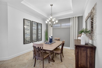 Luxuriously Upgraded Roma Model with Pond Views & Room for a on Esplanade Golf and Country at Lakewood Ranch in Florida - for sale on GolfHomes.com, golf home, golf lot