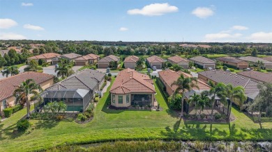 Luxuriously Upgraded Roma Model with Pond Views & Room for a on Esplanade Golf and Country at Lakewood Ranch in Florida - for sale on GolfHomes.com, golf home, golf lot