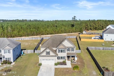 Welcome home to this stunning 5-bedroom, 4.5-bathroom gem in the on Bear Trail Golf Club in North Carolina - for sale on GolfHomes.com, golf home, golf lot