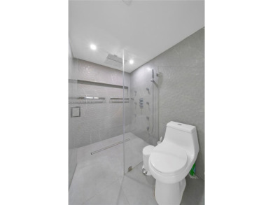 The largest 2-bed, 2-bath corner apartment in the building on Flamingo Lakes Country Club in Florida - for sale on GolfHomes.com, golf home, golf lot