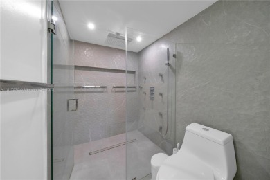 The largest 2-bed, 2-bath corner apartment in the building on Flamingo Lakes Country Club in Florida - for sale on GolfHomes.com, golf home, golf lot