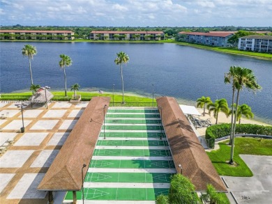 The largest 2-bed, 2-bath corner apartment in the building on Flamingo Lakes Country Club in Florida - for sale on GolfHomes.com, golf home, golf lot