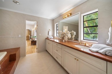 Stunning mediterranean mansion exuding elegance and beach vibes on Miami Beach Golf Club in Florida - for sale on GolfHomes.com, golf home, golf lot