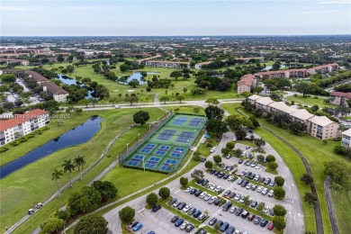 The largest 2-bed, 2-bath corner apartment in the building on Flamingo Lakes Country Club in Florida - for sale on GolfHomes.com, golf home, golf lot