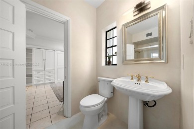 Stunning mediterranean mansion exuding elegance and beach vibes on Miami Beach Golf Club in Florida - for sale on GolfHomes.com, golf home, golf lot