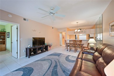 Welcome to this bright and airy first-floor condo in the on Peridia Golf and Country Club in Florida - for sale on GolfHomes.com, golf home, golf lot
