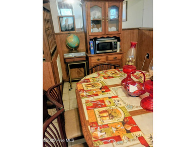 This is a great country house to accommodate a single family or on Land-O-Lakes Golf Course in North Carolina - for sale on GolfHomes.com, golf home, golf lot