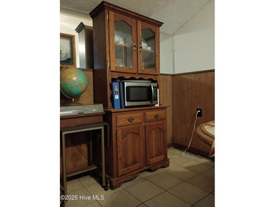 This is a great country house to accommodate a single family or on Land-O-Lakes Golf Course in North Carolina - for sale on GolfHomes.com, golf home, golf lot