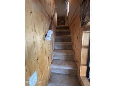 Get a cozy cabin feel in this charming home in desirable Juniper on Juniper Ridge R.V. Golf Resort in Arizona - for sale on GolfHomes.com, golf home, golf lot